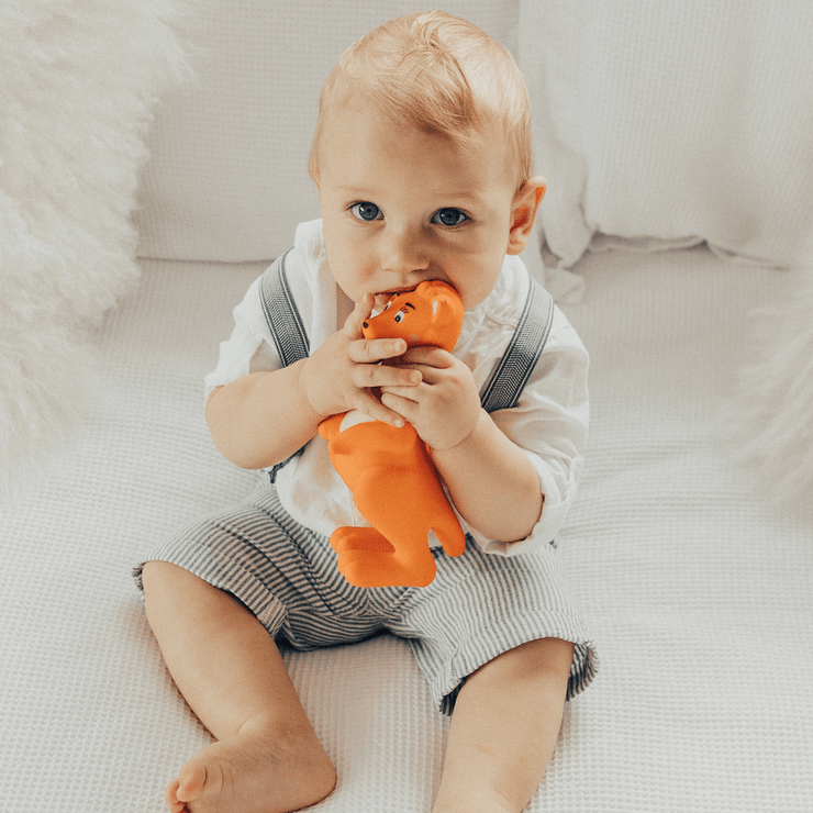 Baby playing with Mizzie The Kangaroo 100% Natural Rubber Teething Toy