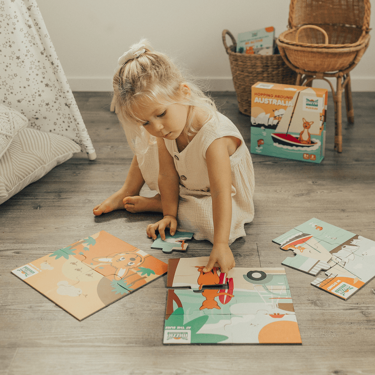 Girl playing with Mizzie Puzzle Box Set Hopping around Australia